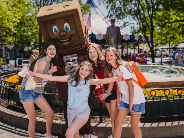 Teenagers standing at the fountain with the Hershey bar character