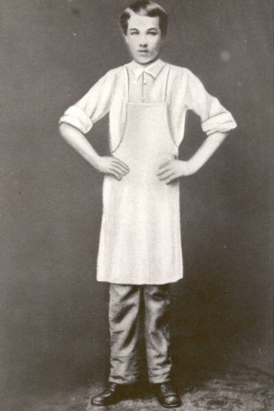 Milton Hershey wearing white apron at Royer's