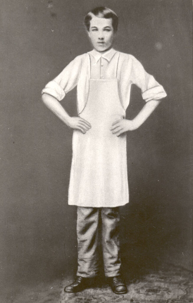 Milton Hershey wearing white apron at Royer's