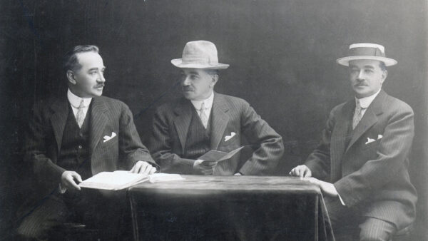 Milton Hershey sitting at a table