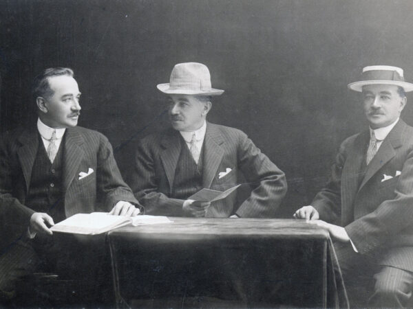 Milton Hershey sitting at a table