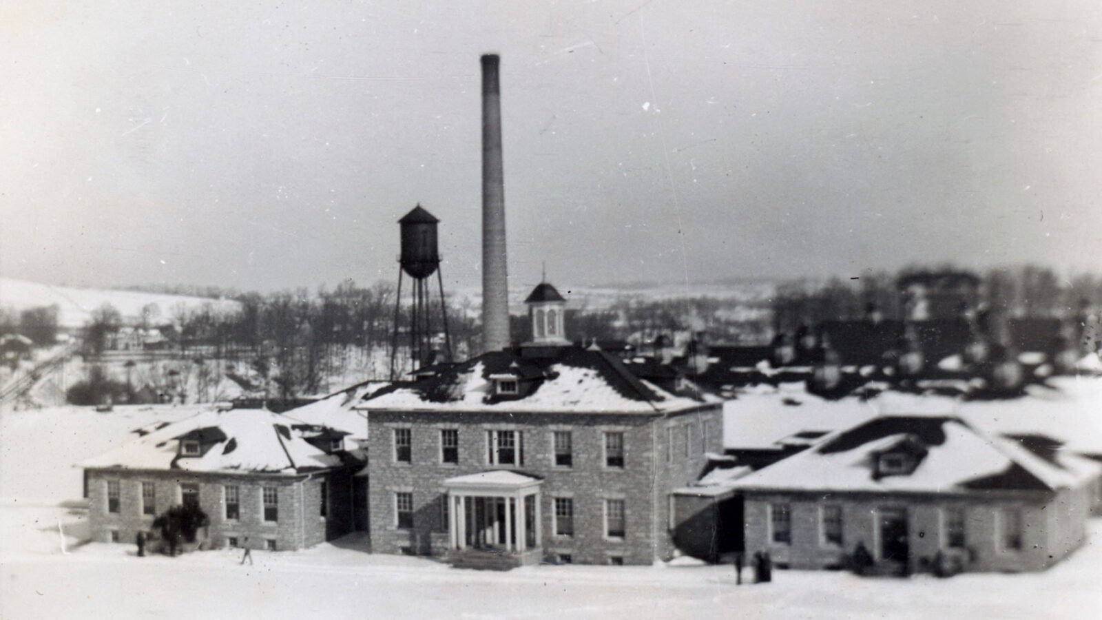 The completed factory and office building in the snow.